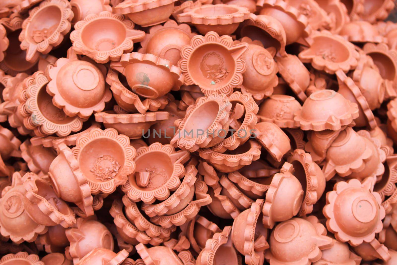 clay lamp (Diya) for sale at Market in india, diya decoration is part of Diwali Festival by tabishere