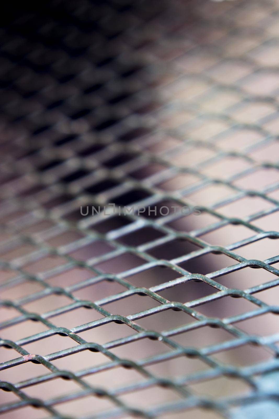 Grating with defocused rhombus shaped background. No people