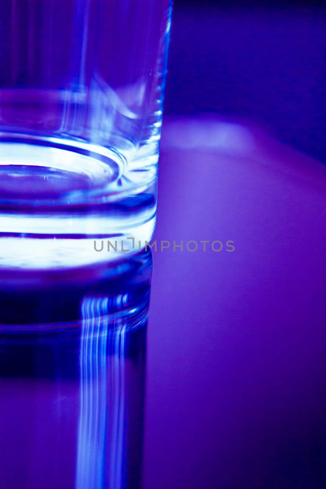 Empty glass transparent glass on dark background. Copy space