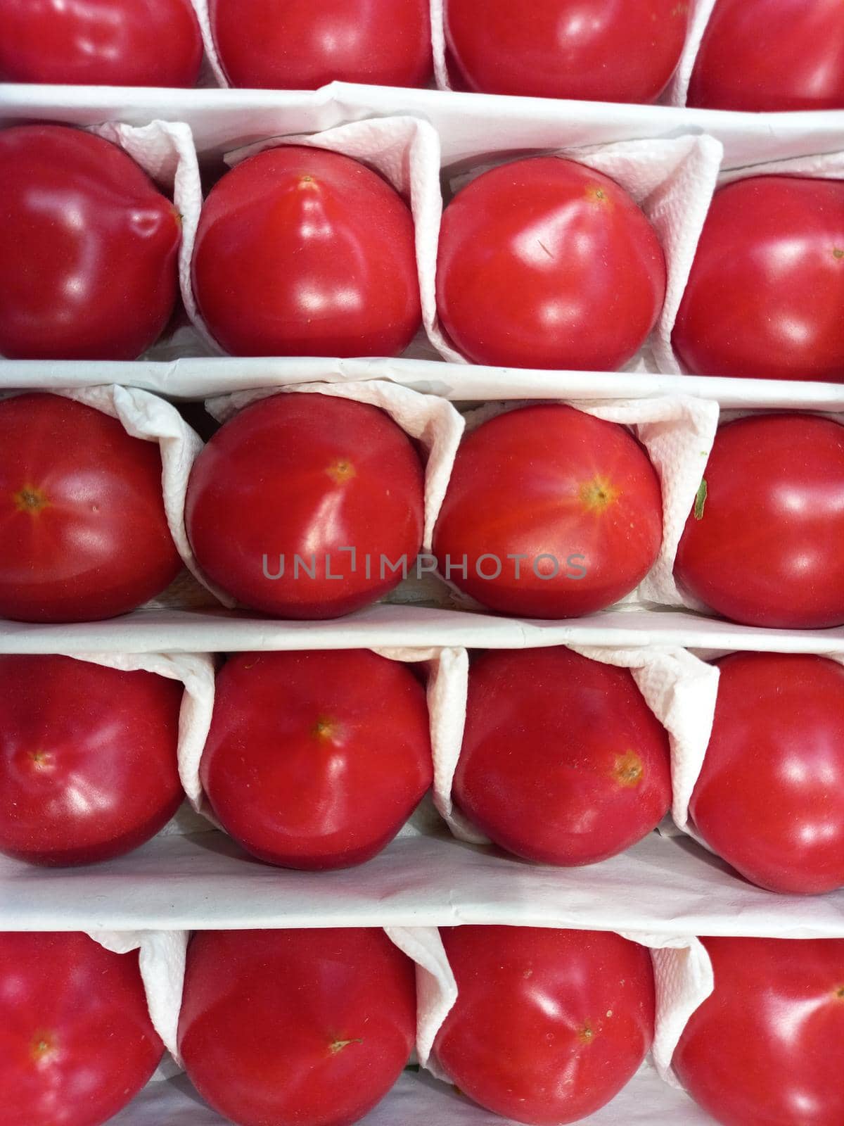 Ripe tomatoes. Red large tomatoes packed in a box. by Olga26