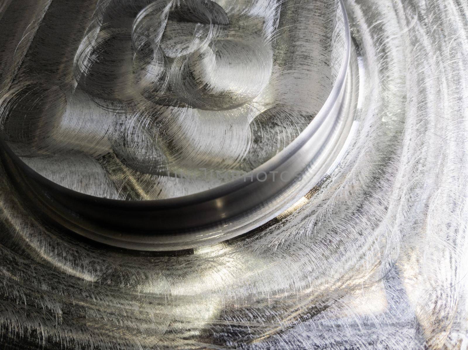 round steel workpiece after cnc surface milling - full frame industrial cnc technology backdrop.