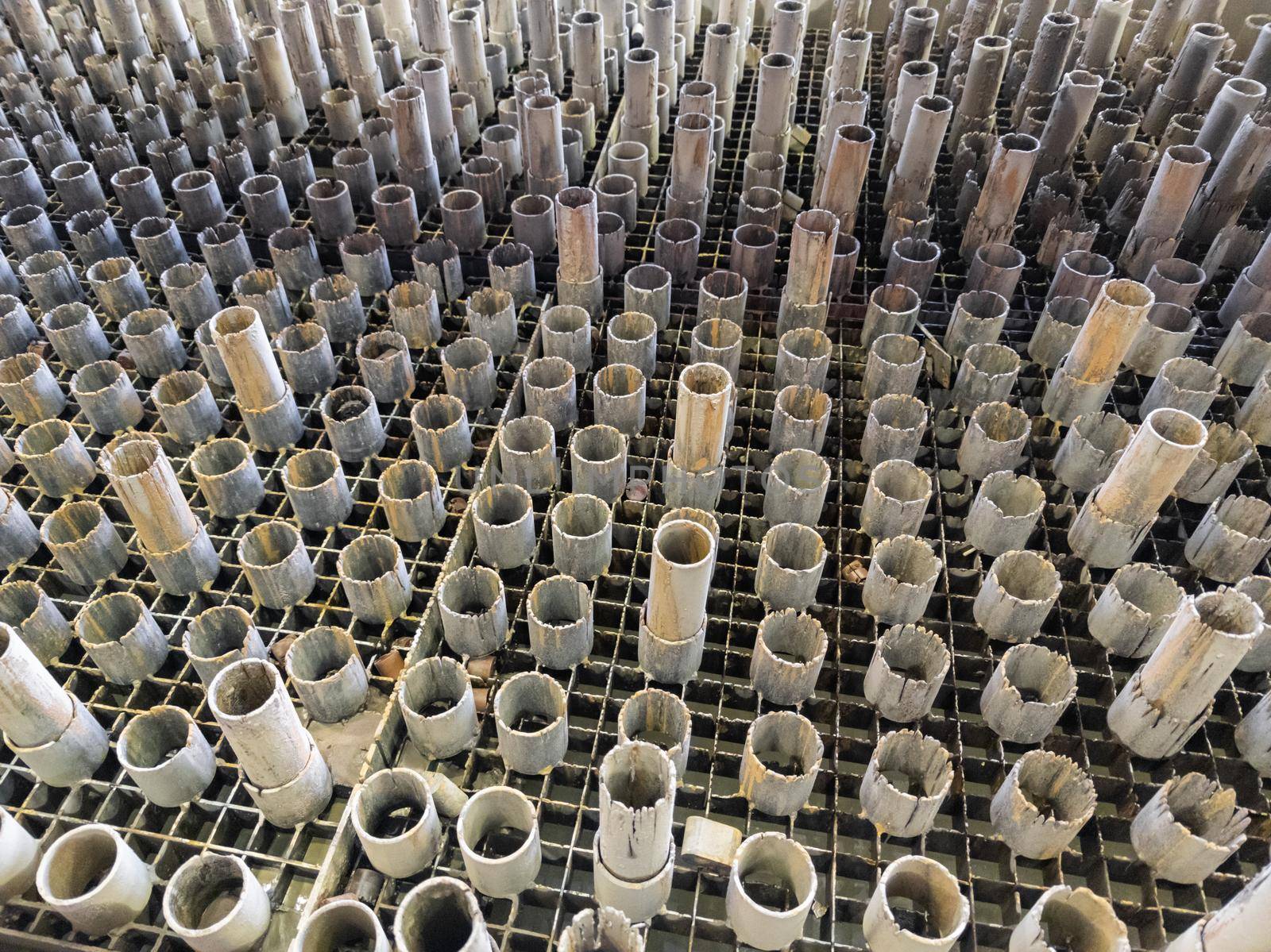 worn out supporting pipes in drained waterjet machine pool during replacement.