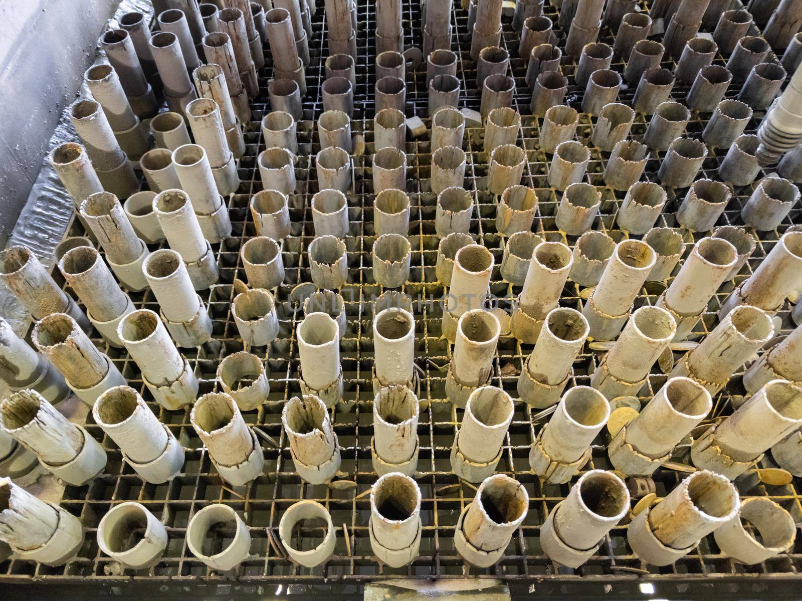 worn out supporting pipes in drained waterjet machine pool during replacement.