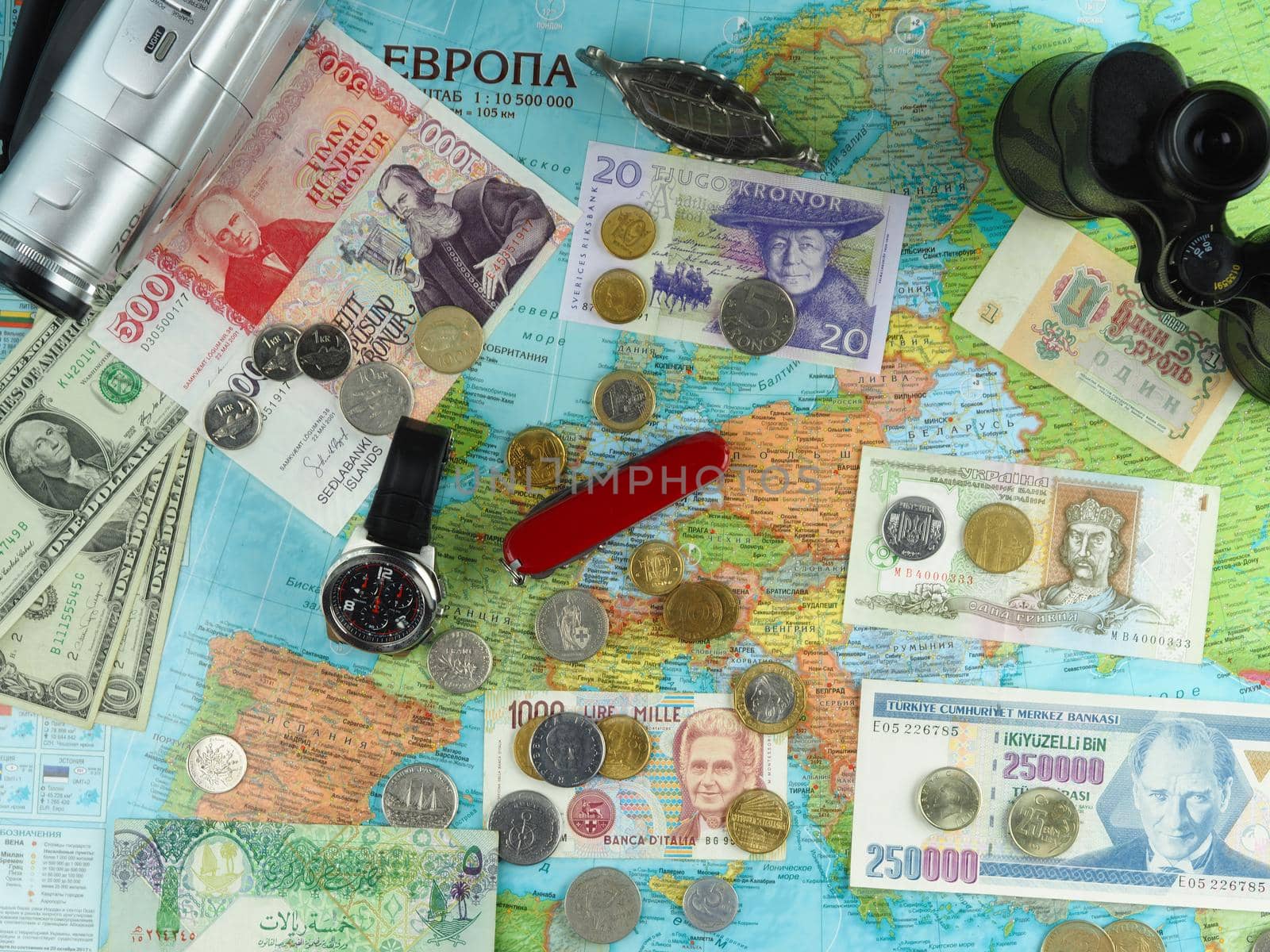 Travelling in Europe. Russian map of Europe and travel items Fled Lay. High quality photo