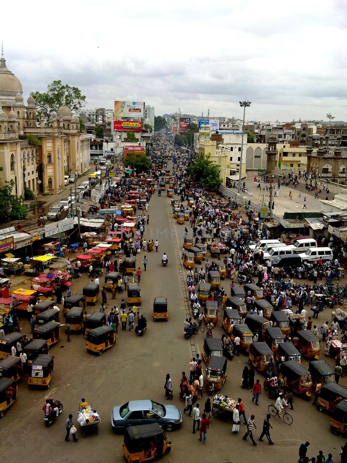 Hyderabad, India December 24, 2011: High angle view of busy street near Charminar, Hyderabad. by tabishere