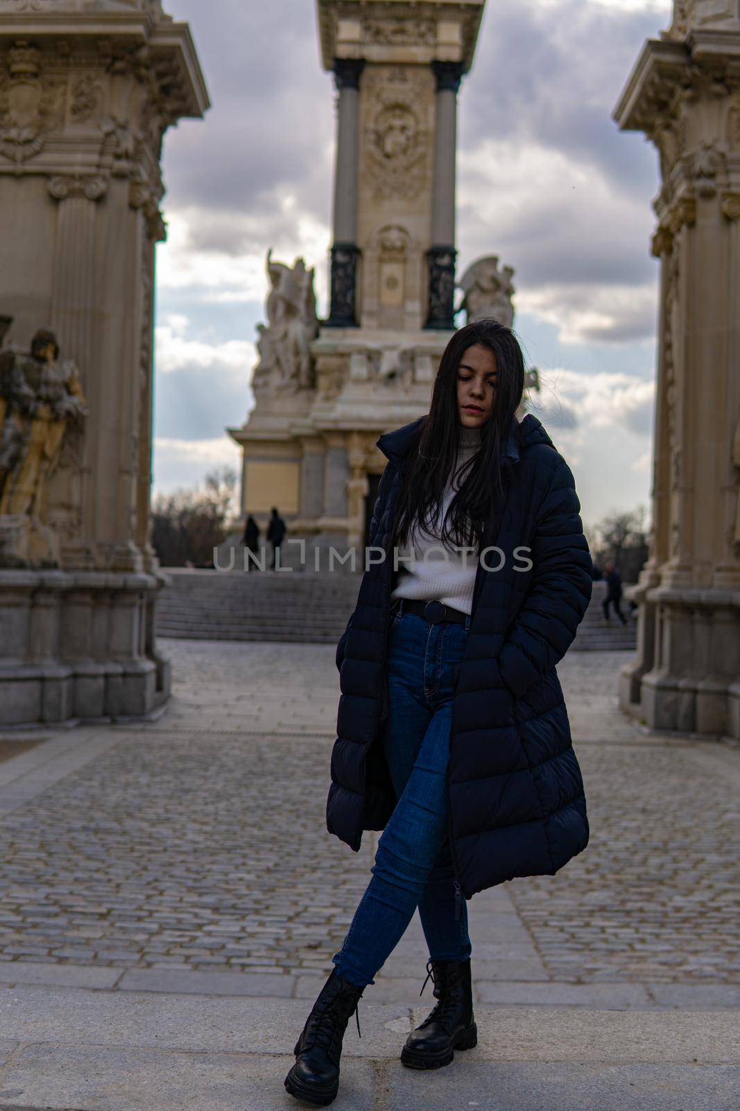 Young Colombian girl with antique architecture in the background by xavier_photo