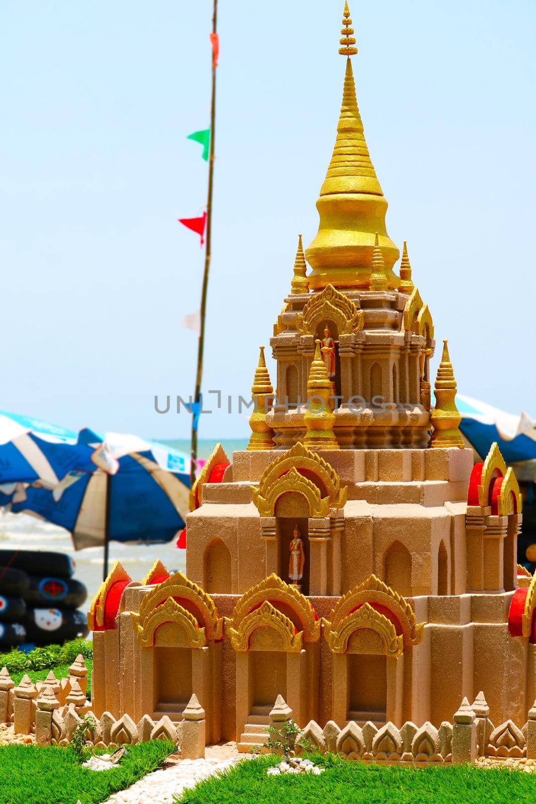 Gold sand pagoda in Songkran festival represents In order to take the sand scraps attached to the feet from the temple to return the temple in the shape of a sand pagoda