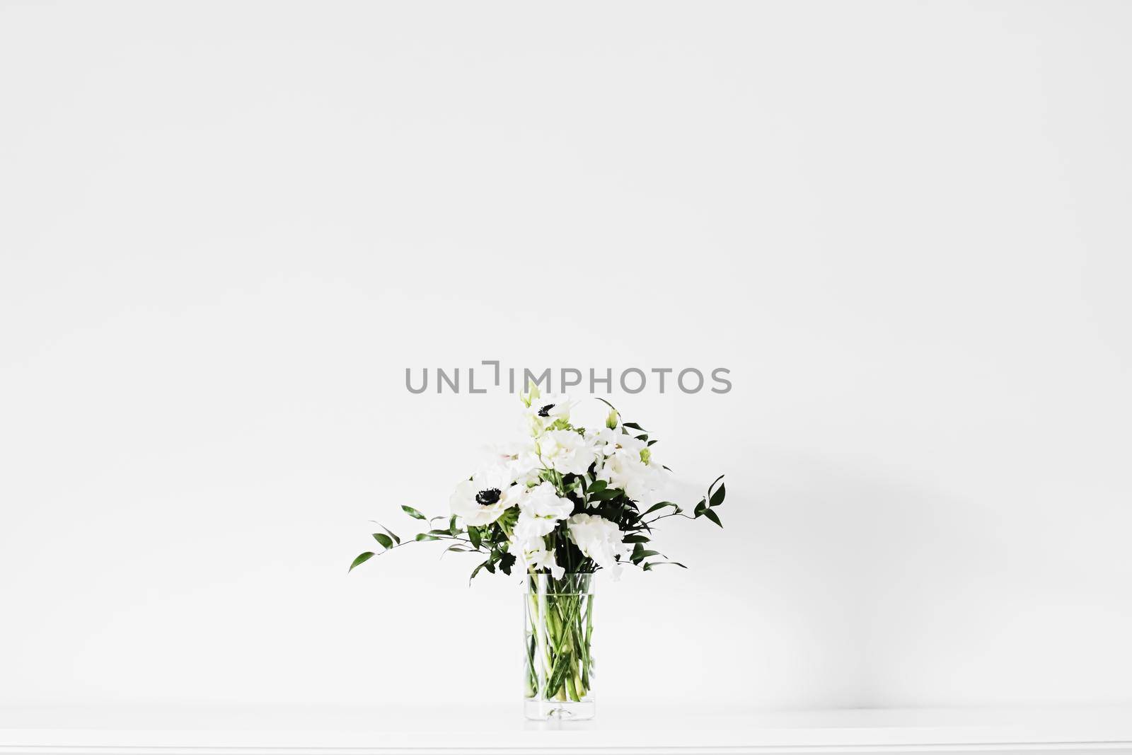 Bouquet of flowers in vase and home decor details, luxury interior design closeup