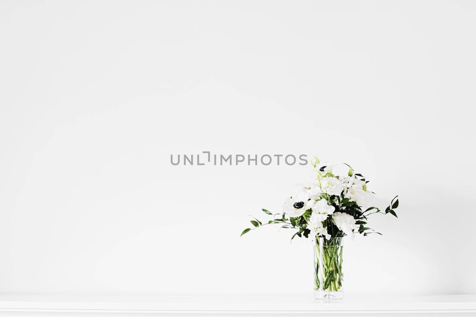 Bouquet of flowers in vase and home decor details, luxury interior design closeup