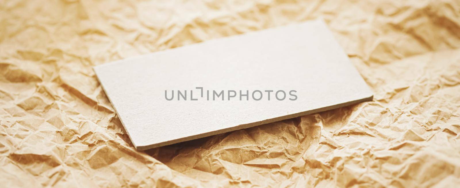 White business card flatlay on brown parchment paper background, luxury branding flat lay and brand identity design for mockups