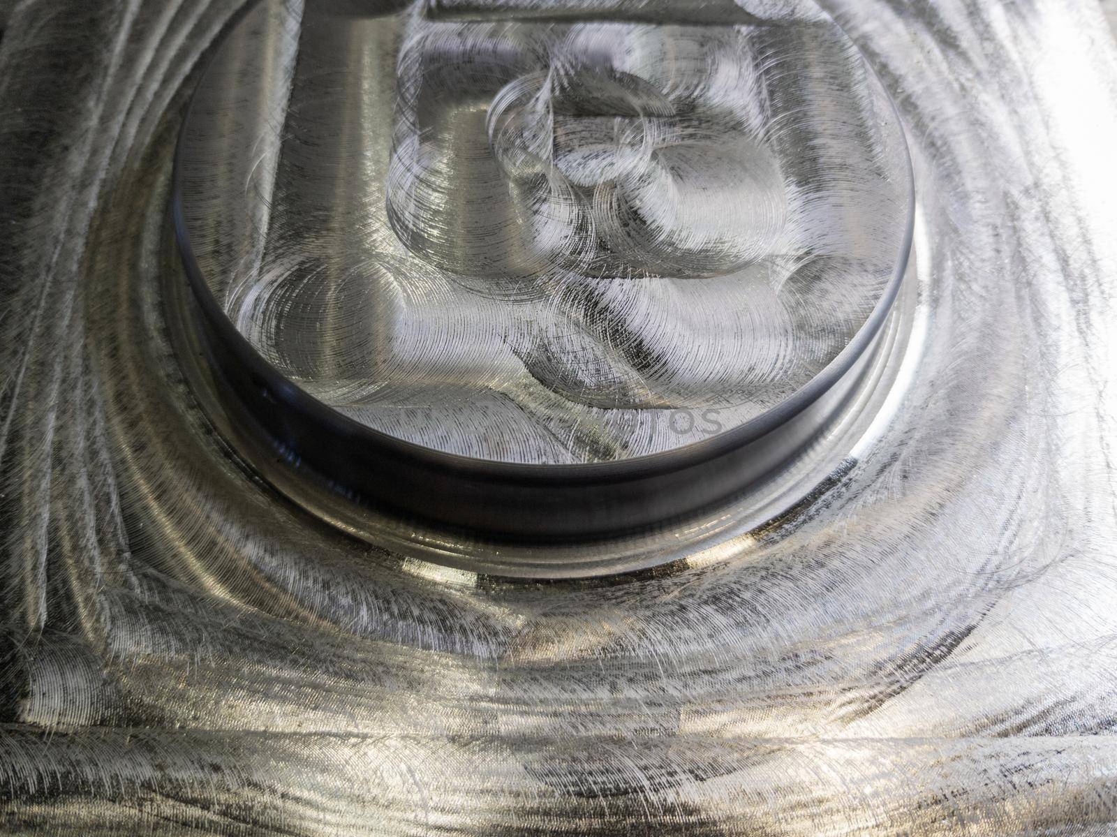 round steel workpiece after cnc surface milling - full frame industrial cnc technology backdrop.