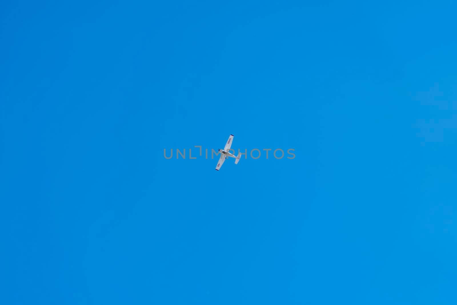 a pleasure plane in a clear blue sky. High quality photo