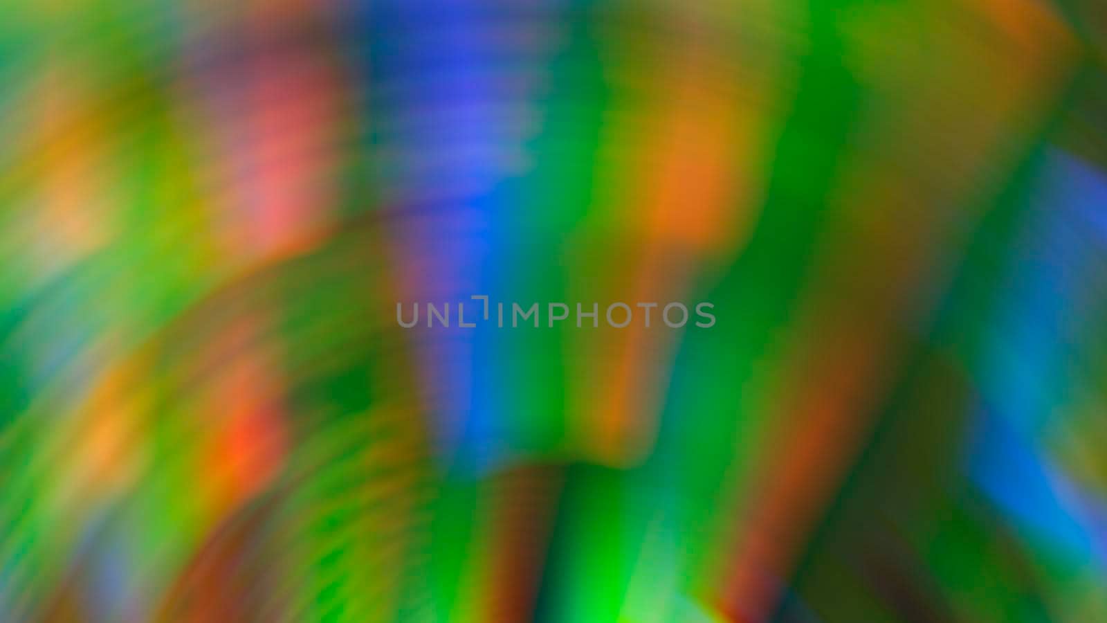 Abstract blurry green background with rainbow glow.