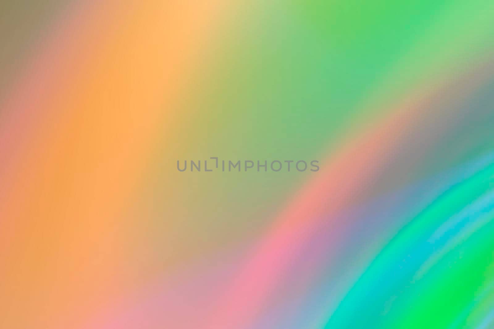 Abstract blurry green background with rainbow glow.
