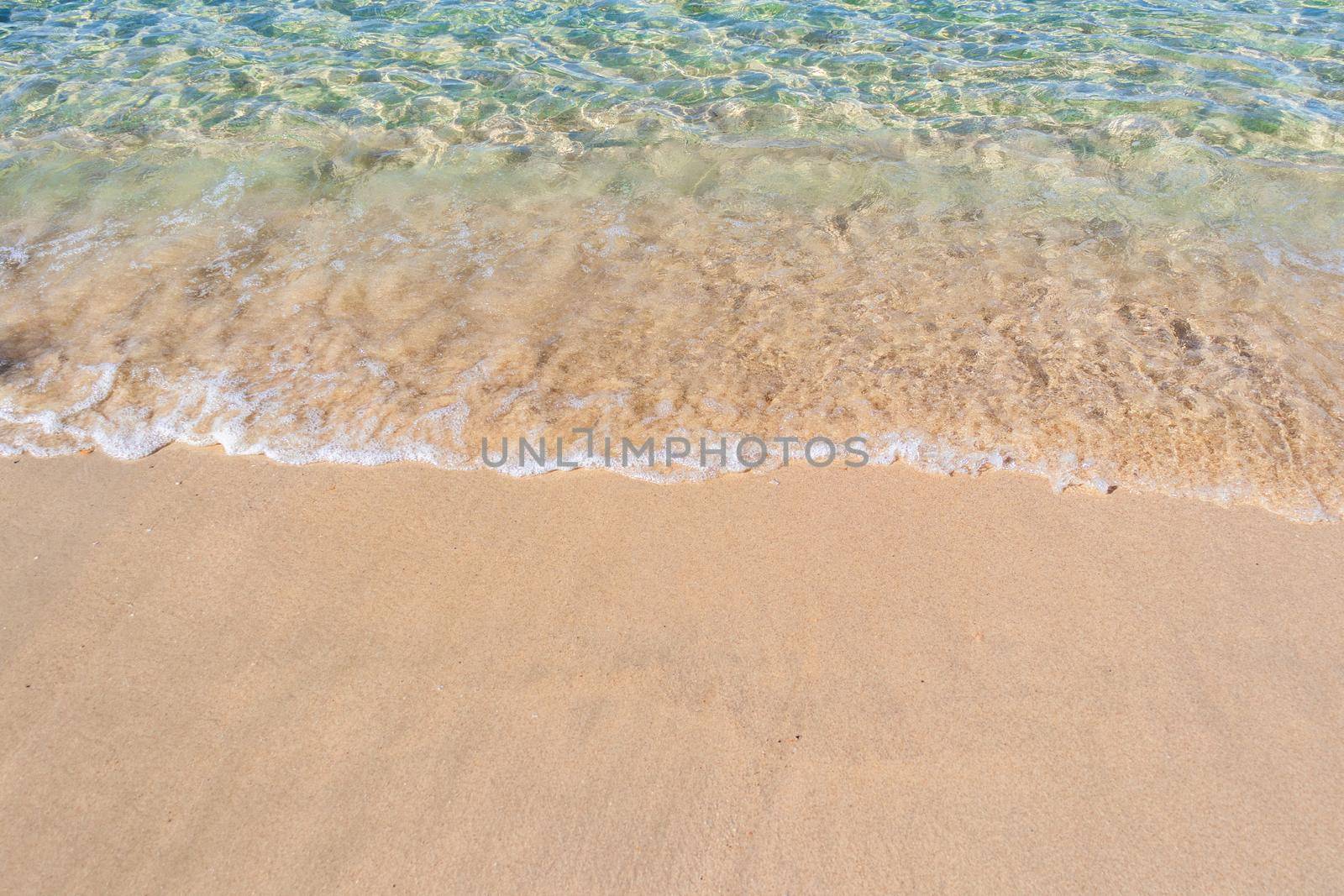 Clear blue transparent tropical summer beach water background by kaisorn