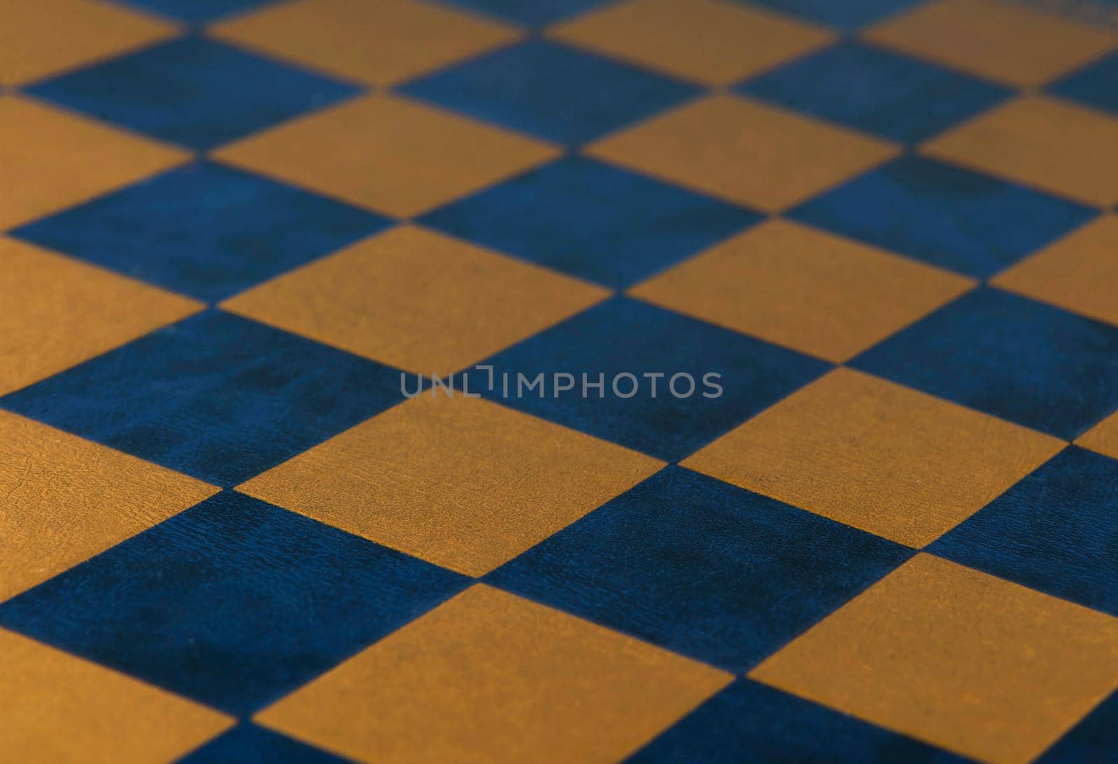 Chess board. Leather checkered texture background of blue and gold color