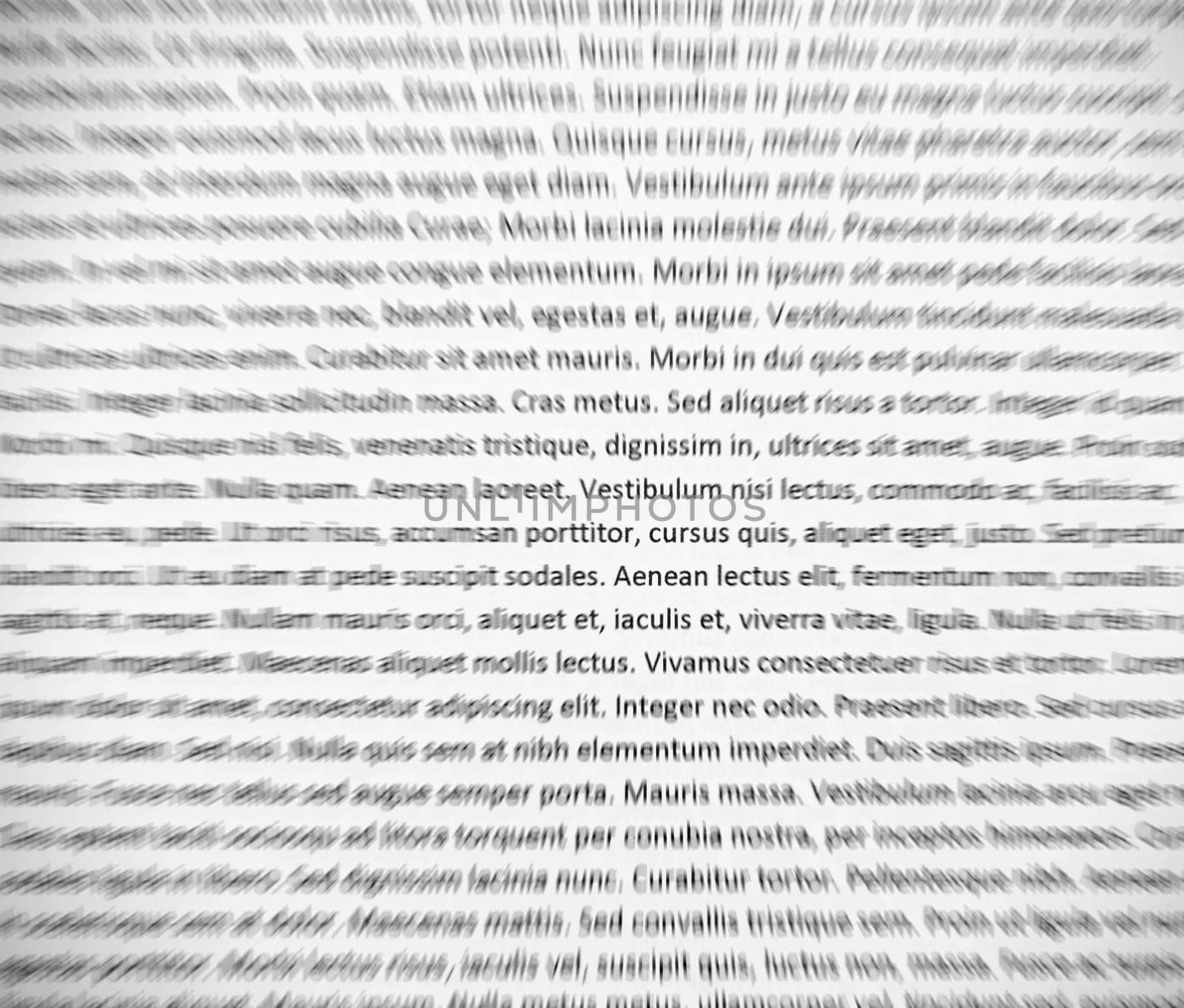 Closeup of lorem ipsum text on white paper, abstract zoom effect.