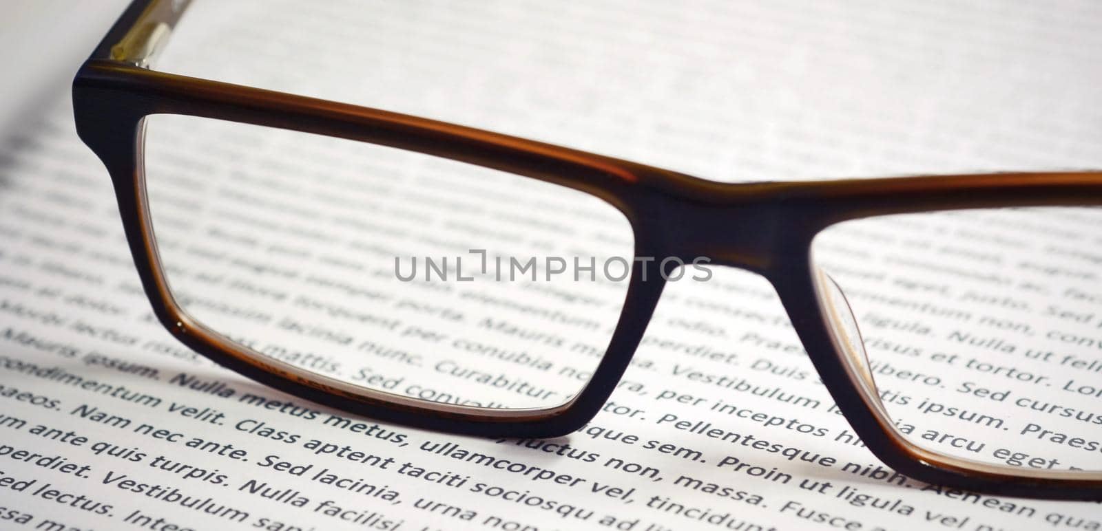 Eyeglasses on paper with lorem ipsum by hamik
