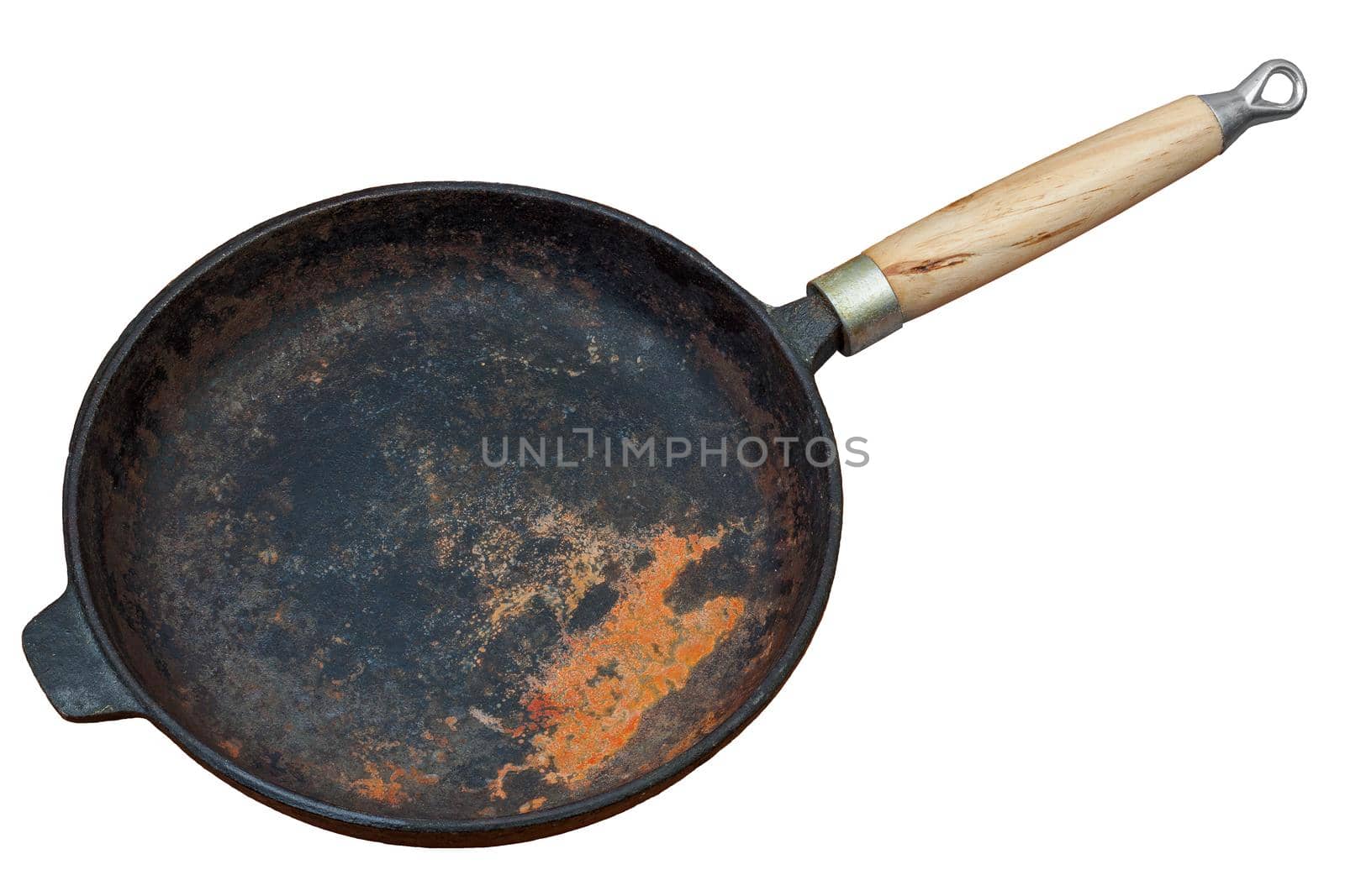 Rusted cast iron pan with wooden grip isolated on white background