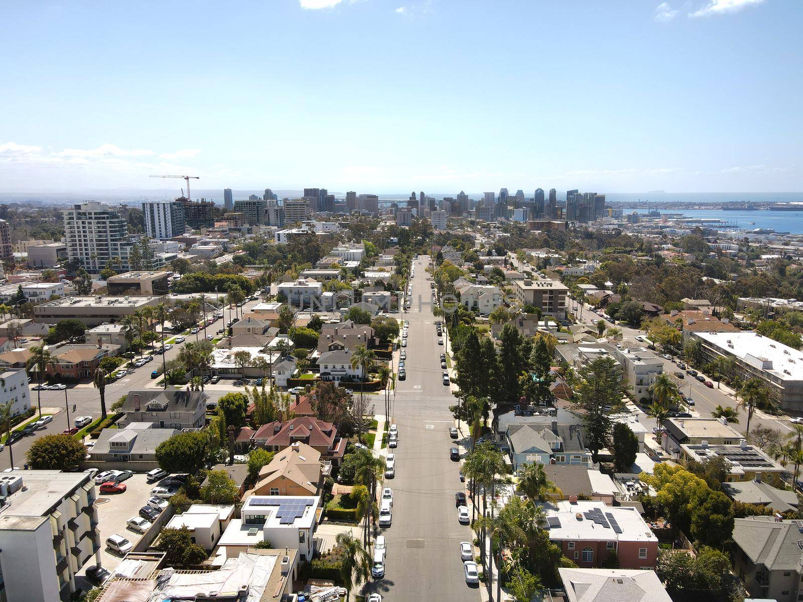 Aerial view above Hillcrest neighborhood with downtown San Diego on the background by Bonandbon