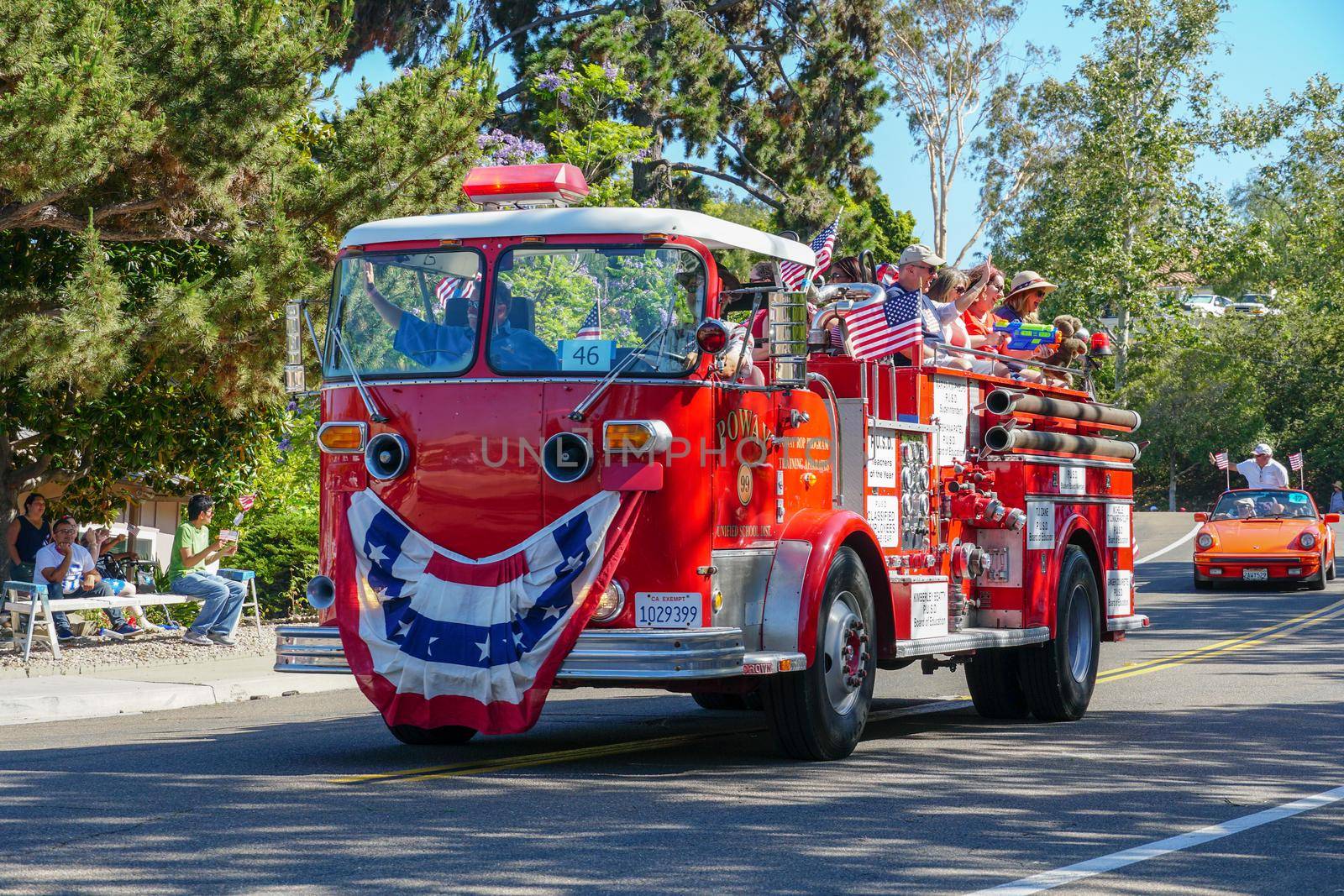 Old Firetruck and people at the July 4th Independence Day Parade in Rancho Bernardo, San Diego, California, USA. July 4th 2020