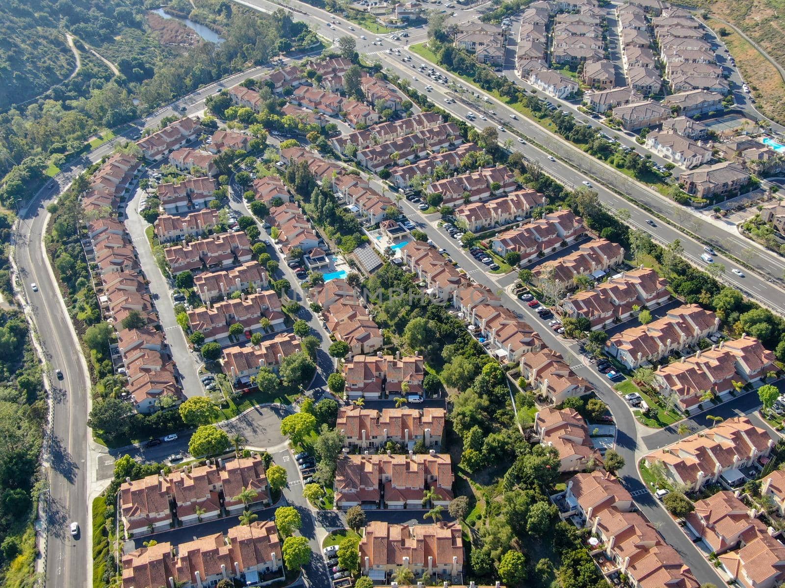 Aerial view of upper middle class neighborhood with big villas around in San Diego by Bonandbon