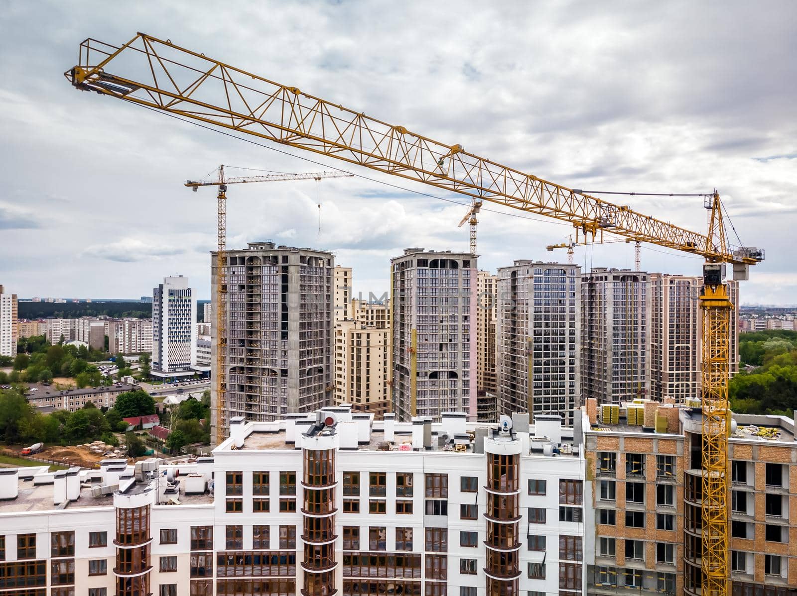 Busy Construction Site And Construction Equipment And Cranes. Aerial Photo.