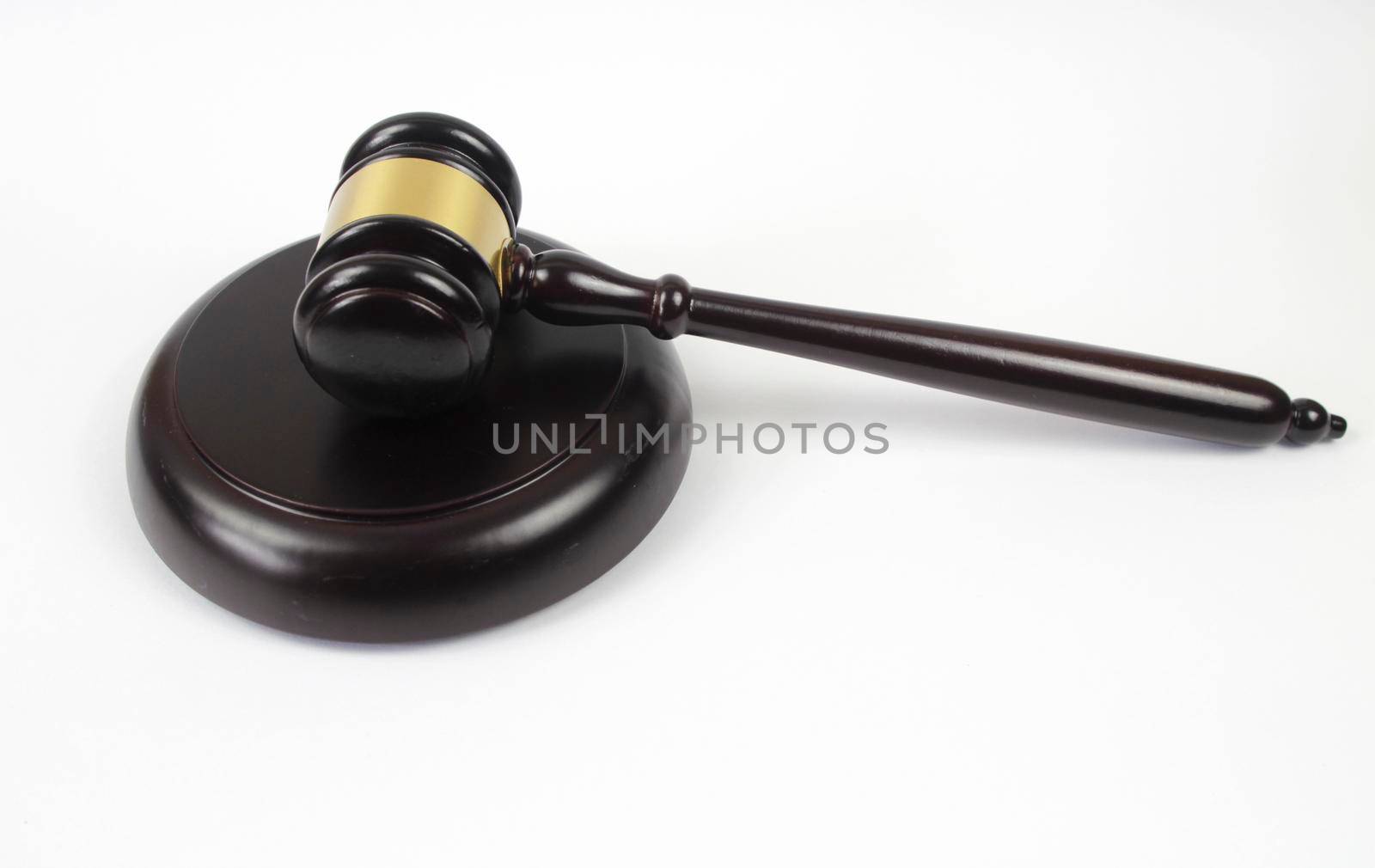 Wooden judge hammer or gavel on white background