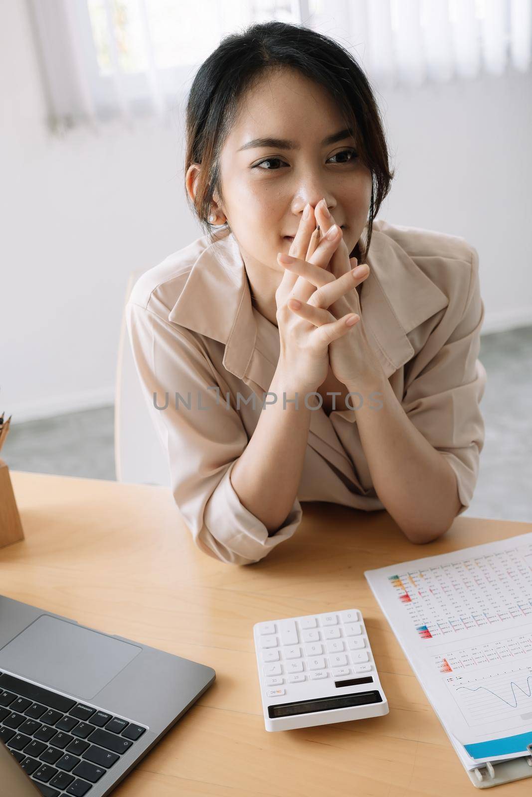 Portrait Young female accountant thinking for financial report in office