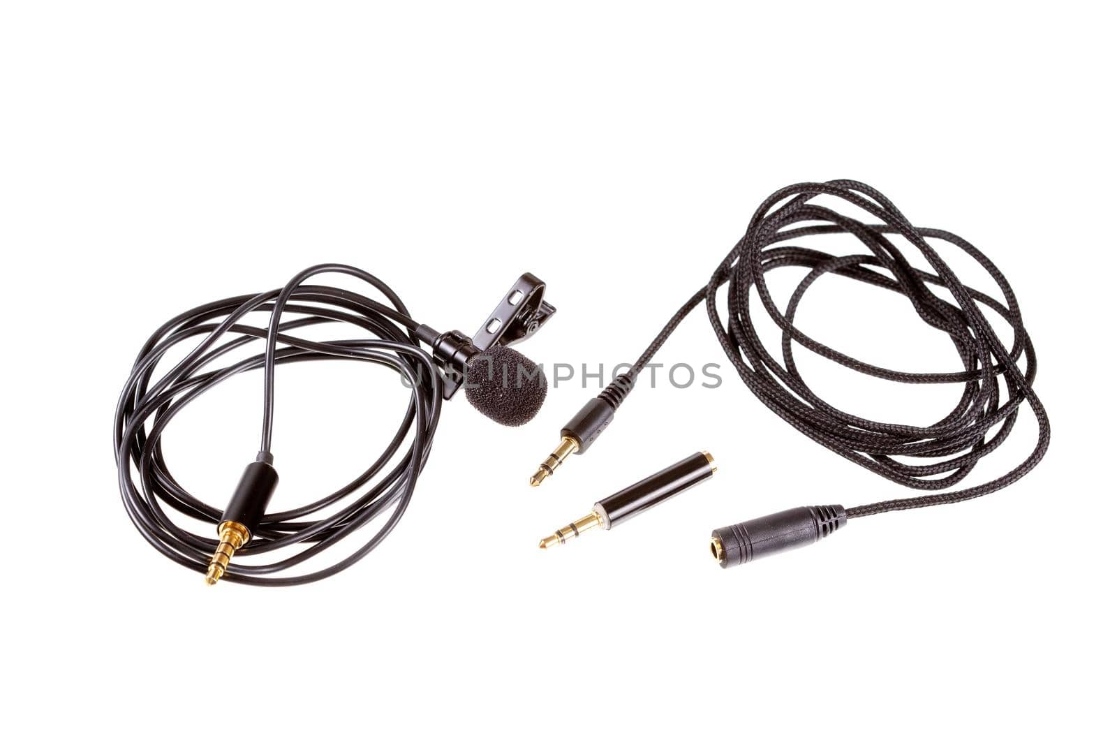 Small lavalier microphone or lapel mic with clip, adapter and extension cable for computer.Professional sound recording equipment for cell phone.