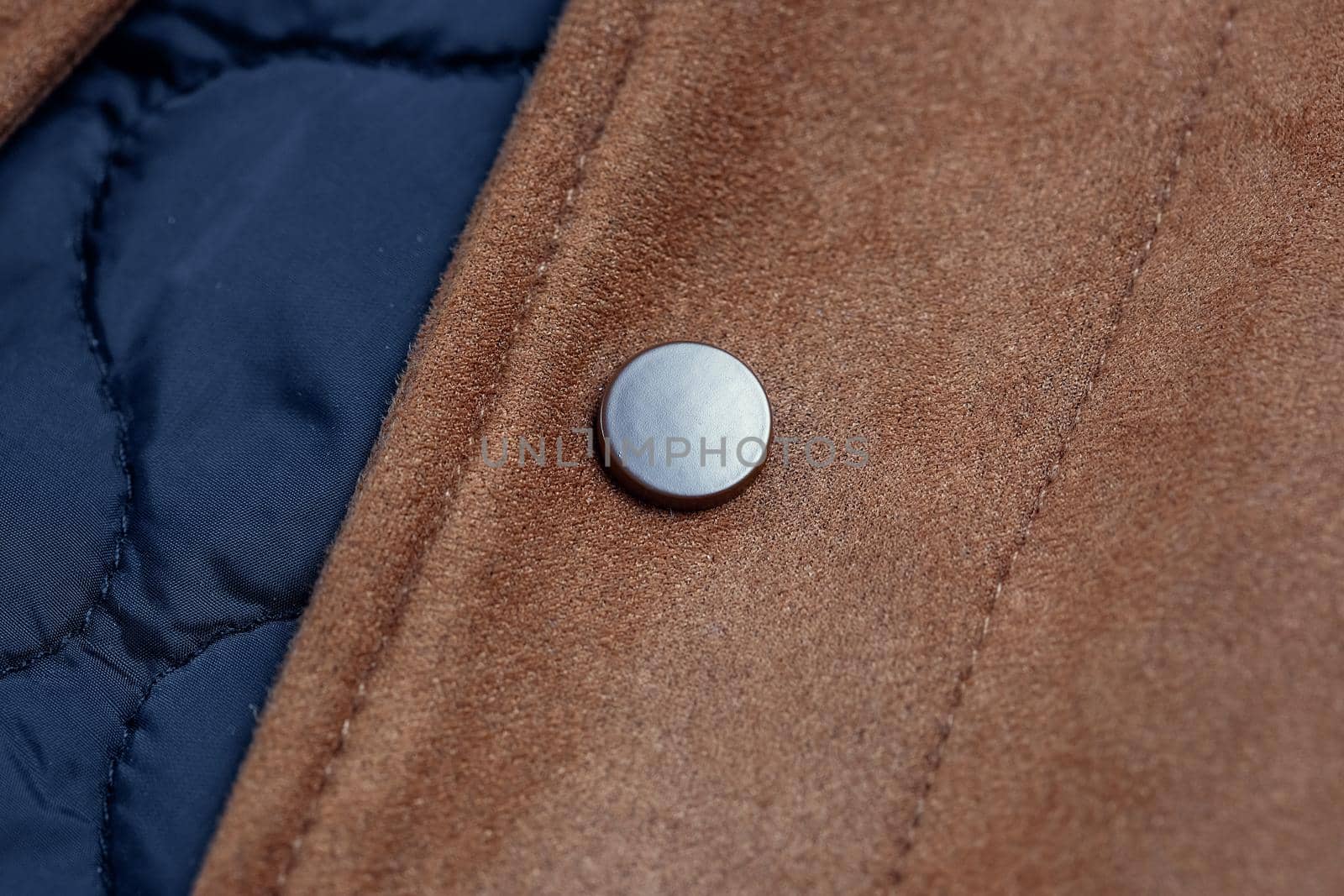 Close-up of a button-down button on a faux suede jacket by galinasharapova