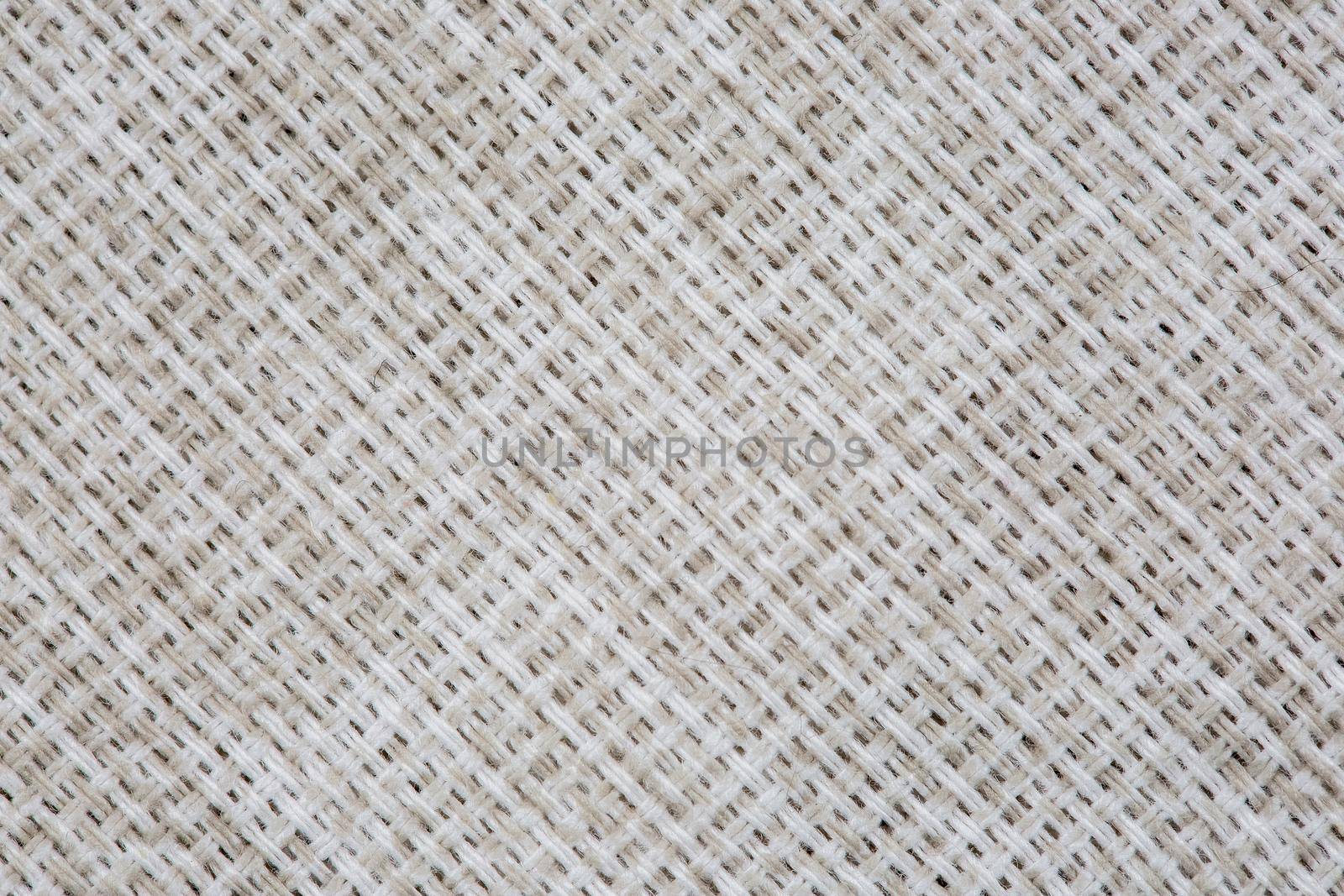 Close-up texture of factory fabric, interlacing of threads.