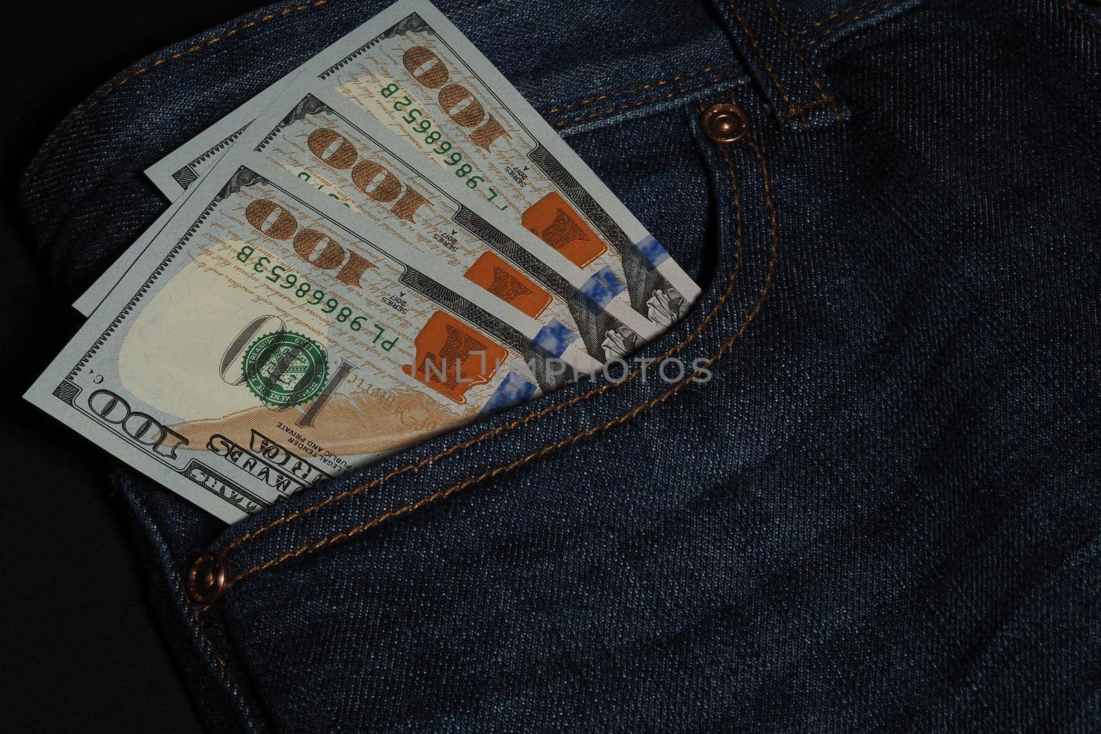 Cash, American currency, dollars in jeans pocket. by Olga26