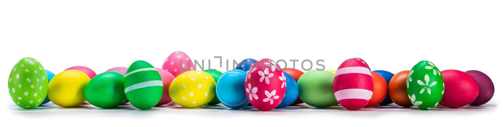 A row of decorated easter eggs isolated on white background