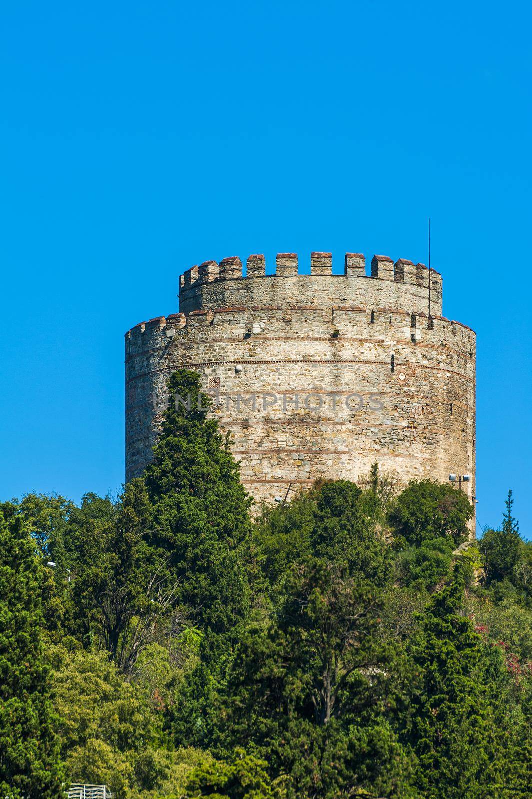 Tower of ancient medieval castle Rumeli Hisari built on a hill above a Bosphorus in Istanbul in Turkey. The fortress was constructed by Ottoman Turks in 15th century before the siege of Byzantine capital Constantinople