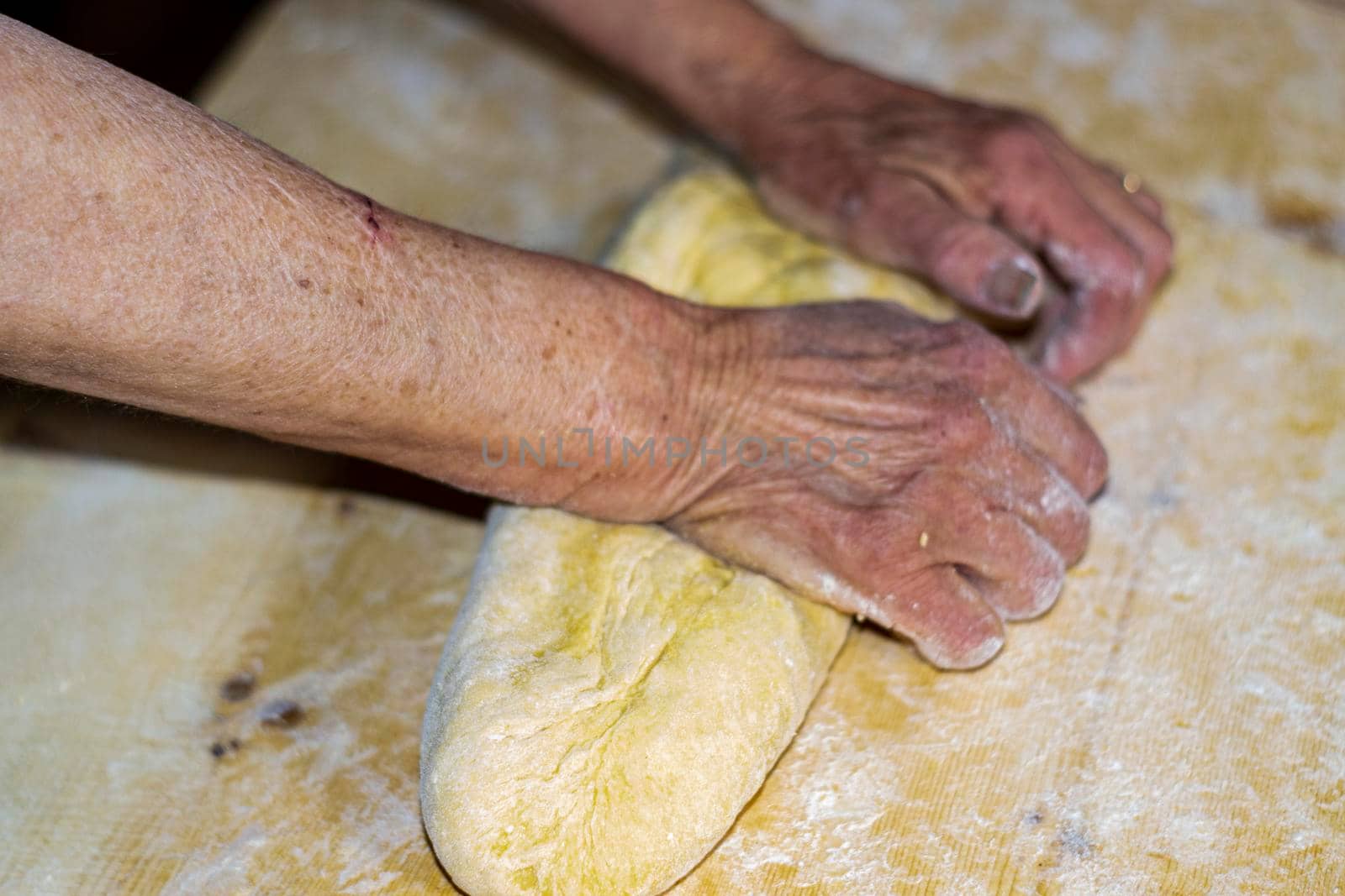 grandmother preparing homemade pasta by carfedeph