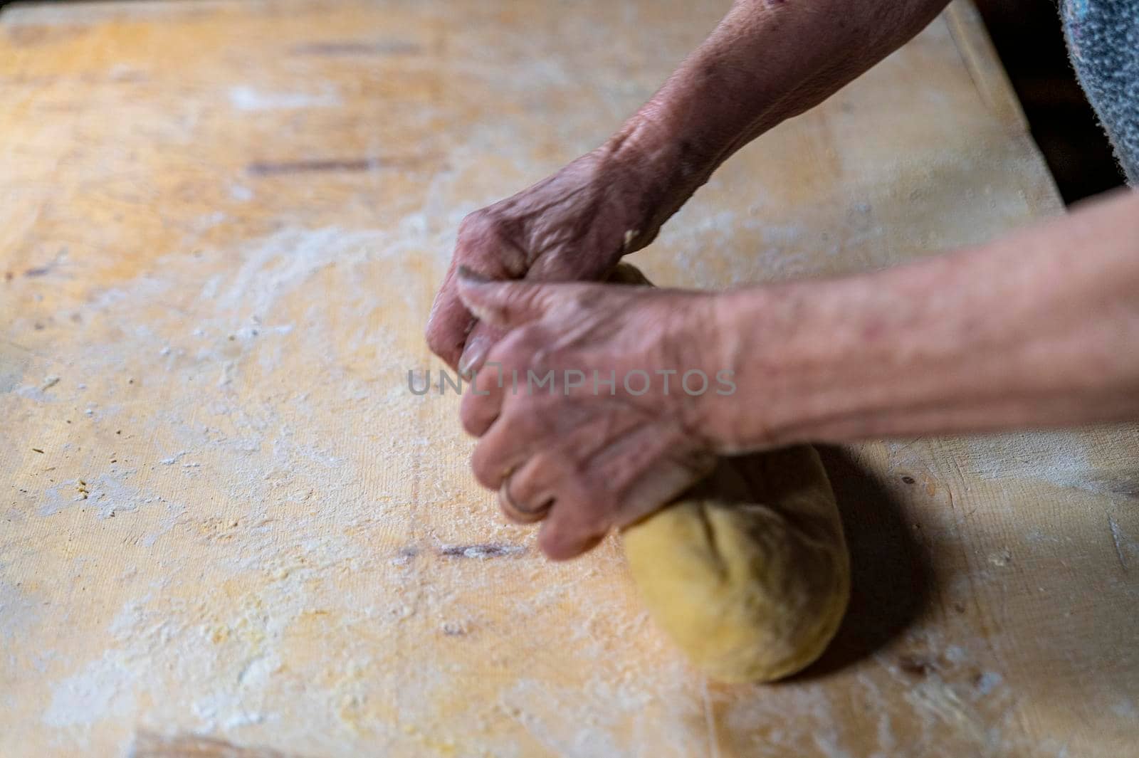 grandmother preparing homemade pasta by carfedeph