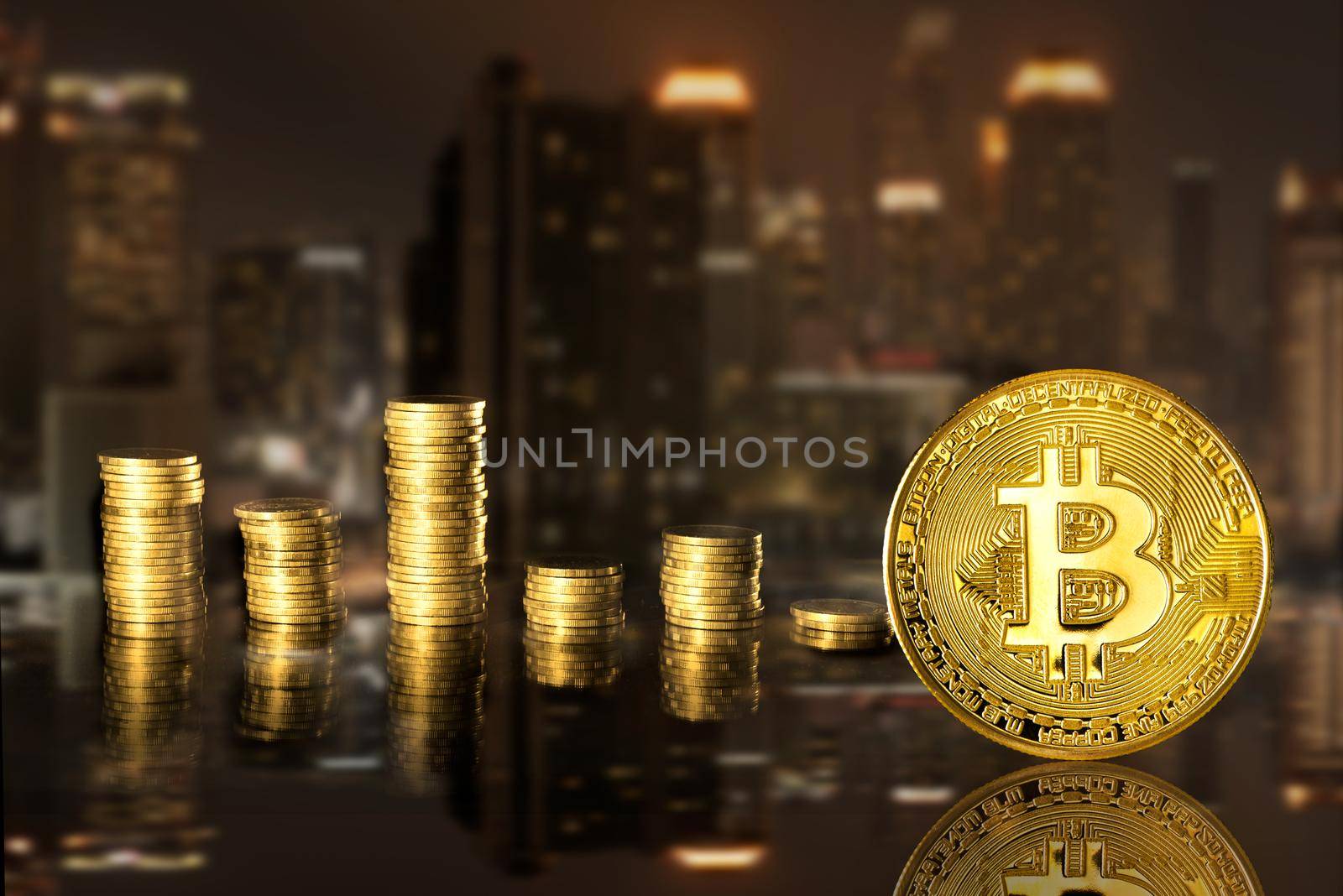 Bitcoin and stack coins of baht on the night city background.  Finance and investment concept.