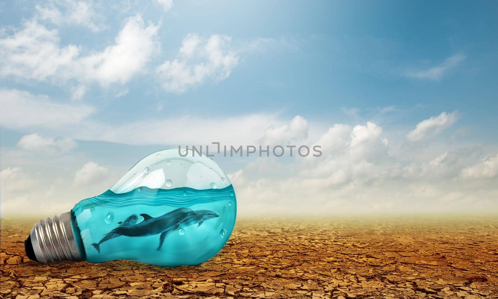 Light bulb with Dolphins swimming inside oncracked earth. Saving environment and natural conservation concept.