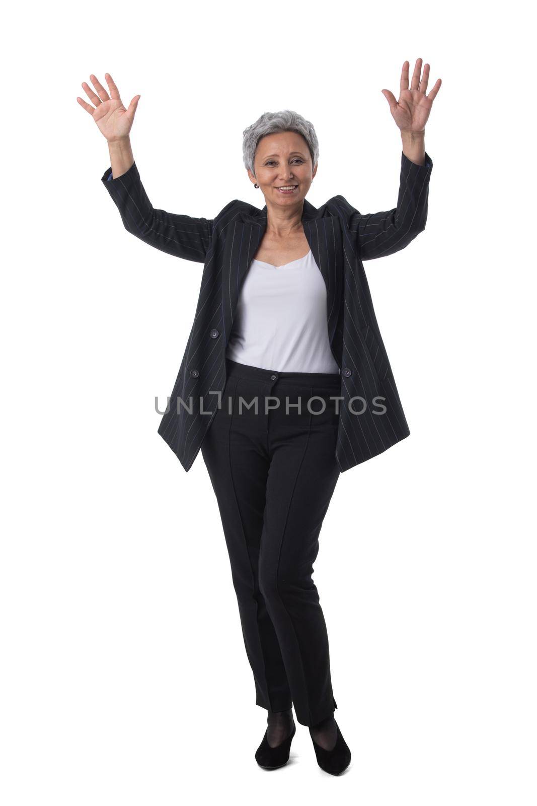 Mature asian business woman winner with raised arms isolated on white background full length studio portrait