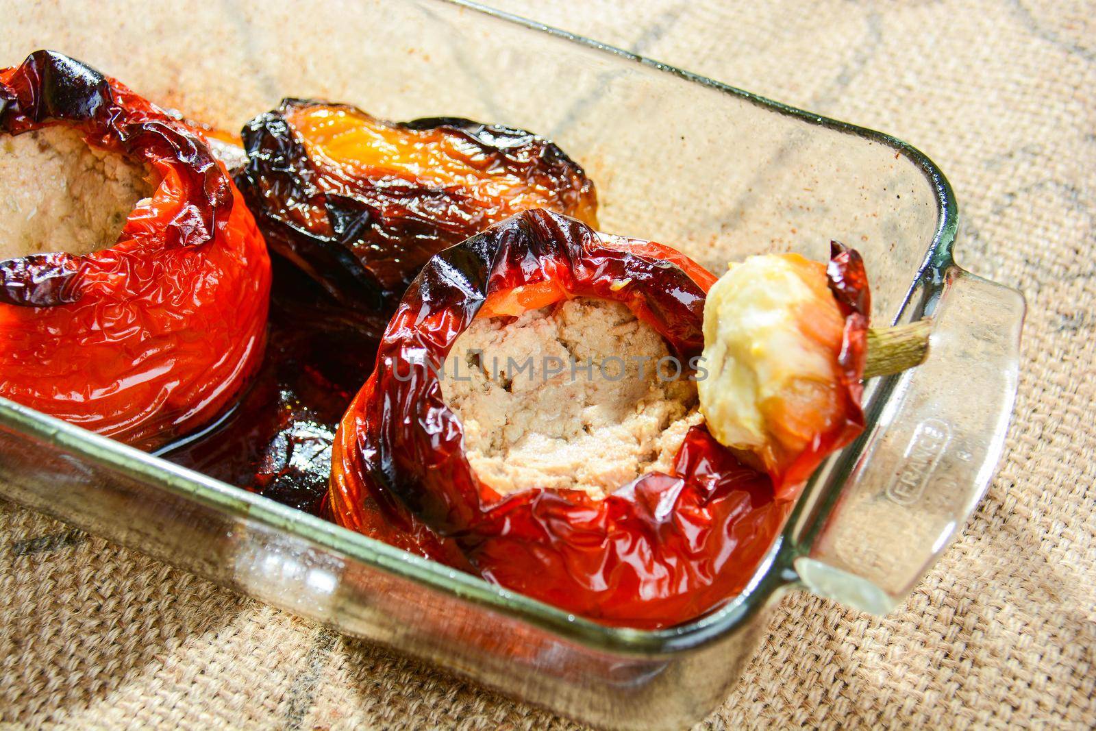 Italian cuisine, baked stuffed peppers with tuna capers and Parmesan cheese