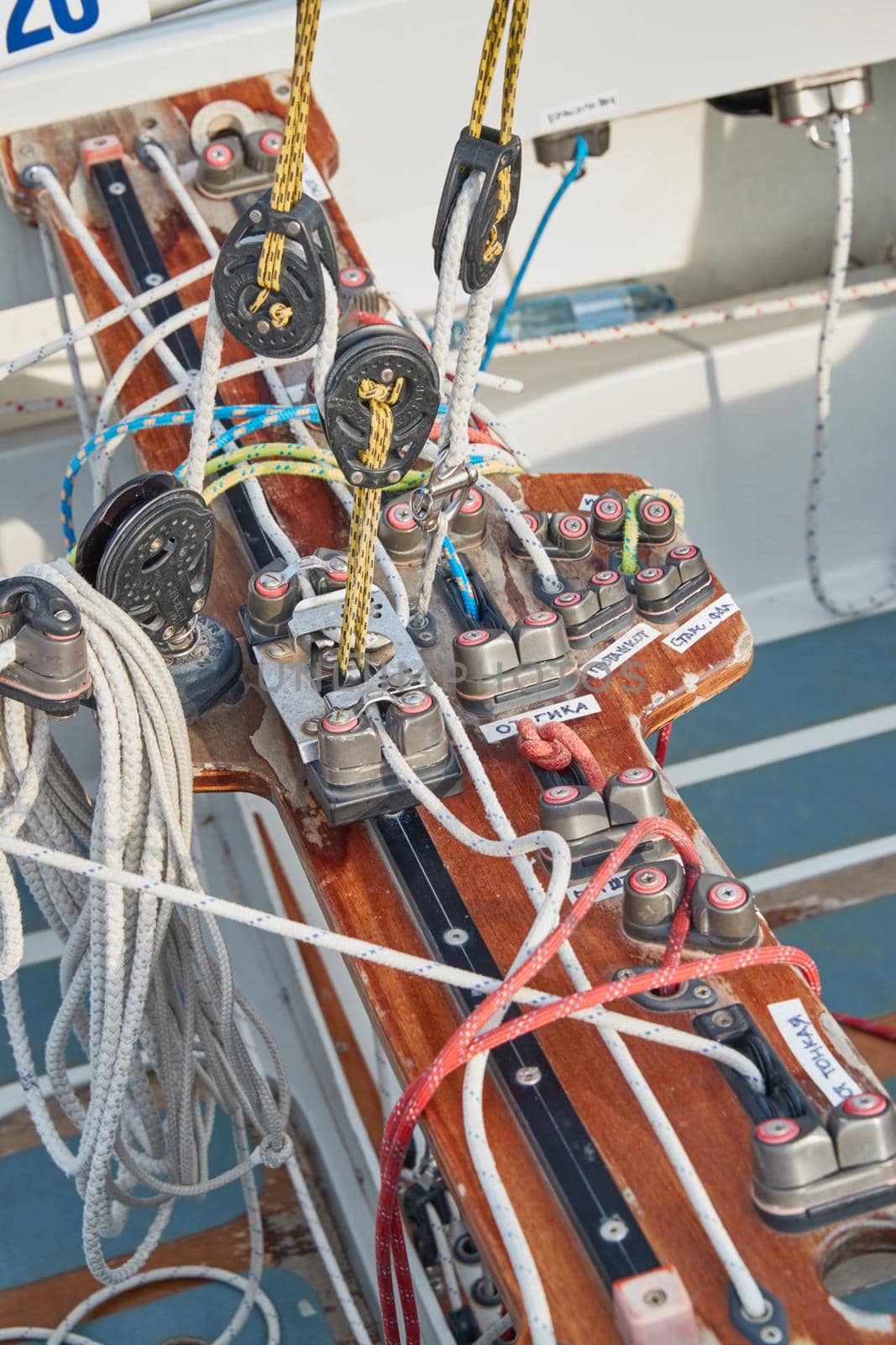 Set of ropes for management of the sailboat of different color, the signature to each rope, rollers, levers, carbines, clamps, the dragon sailboat. High quality photo