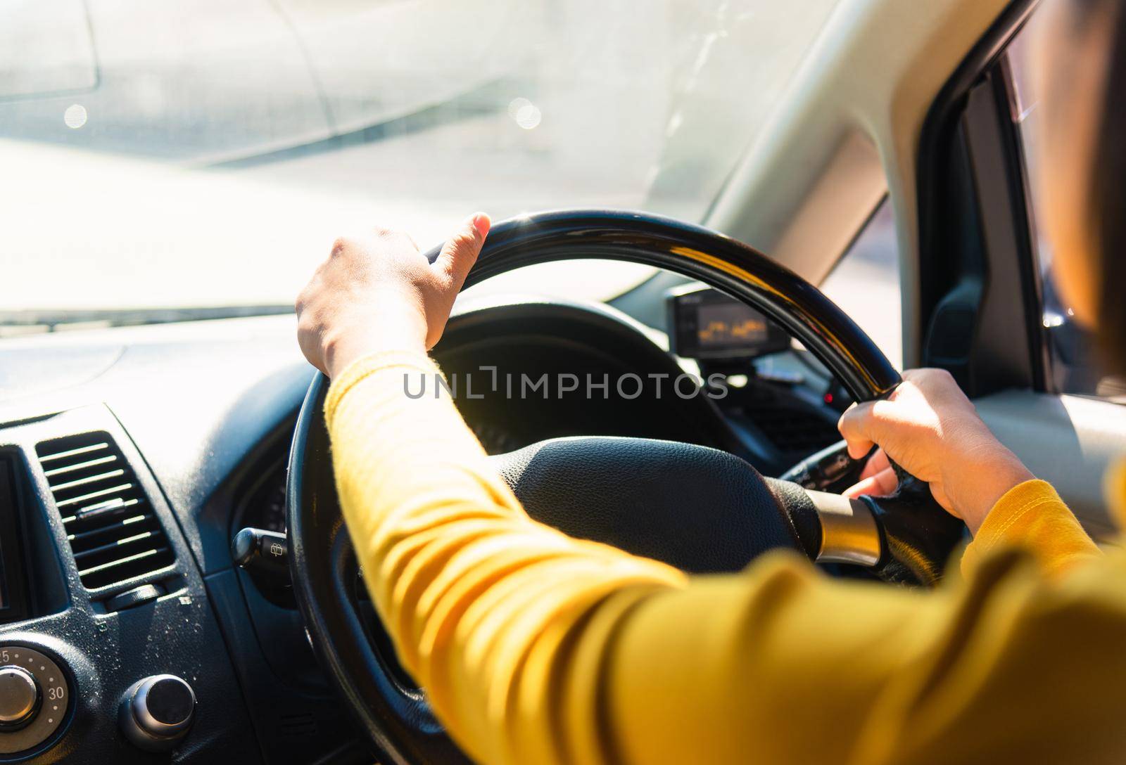 woman while driving the car by Sorapop