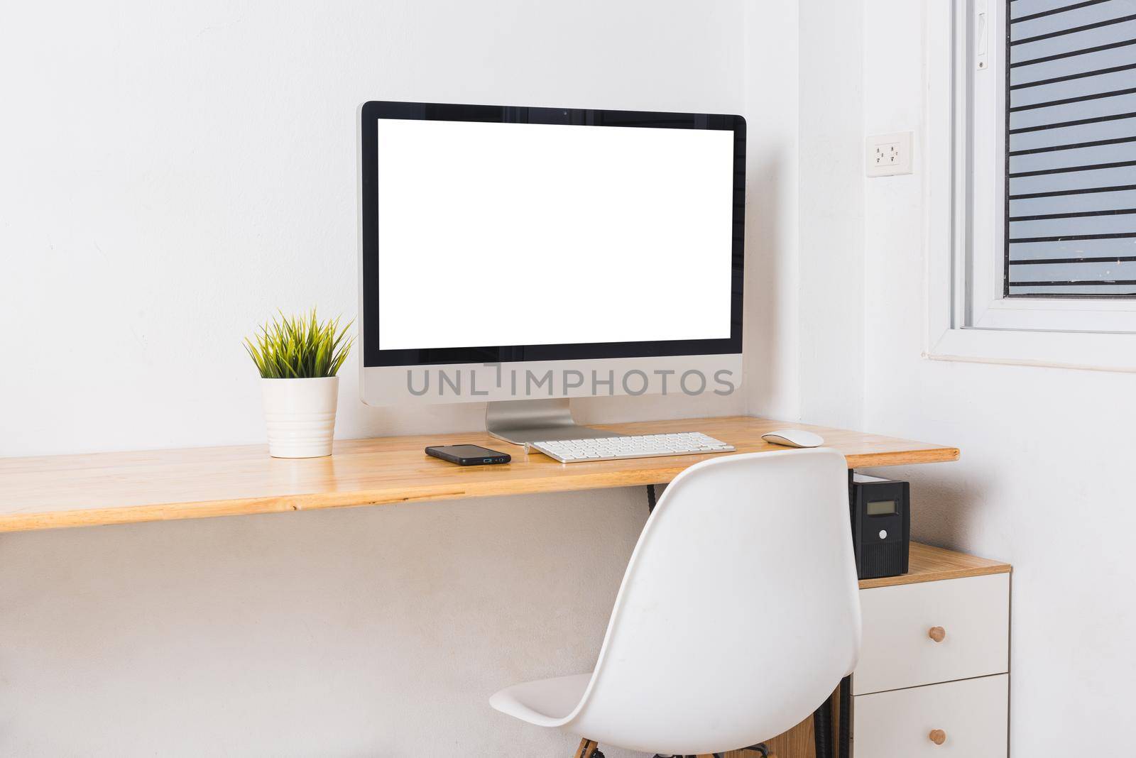 Computer monitor with white blank screen on the business desk by Sorapop