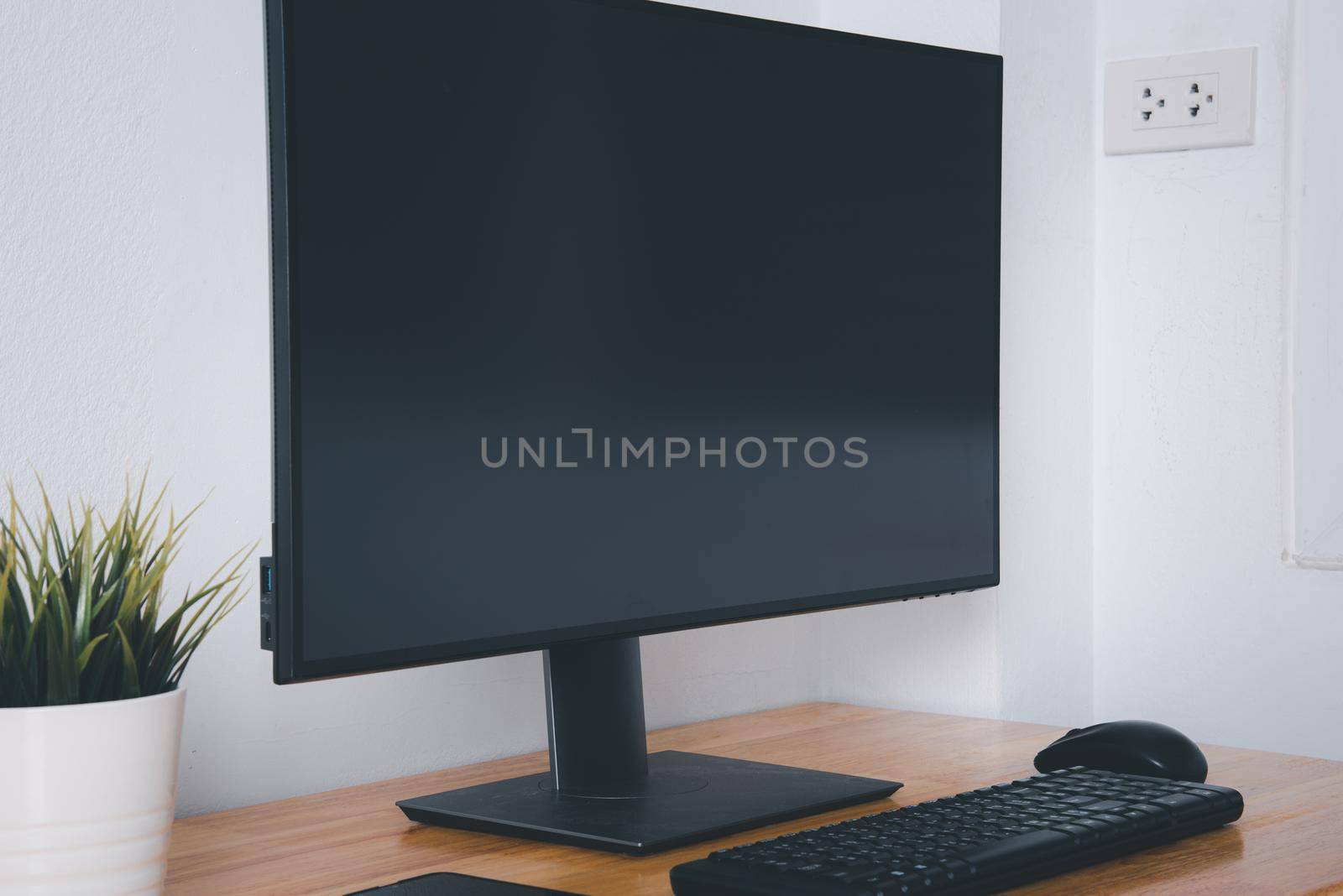 Computer monitor with white blank screen on the business desk by Sorapop