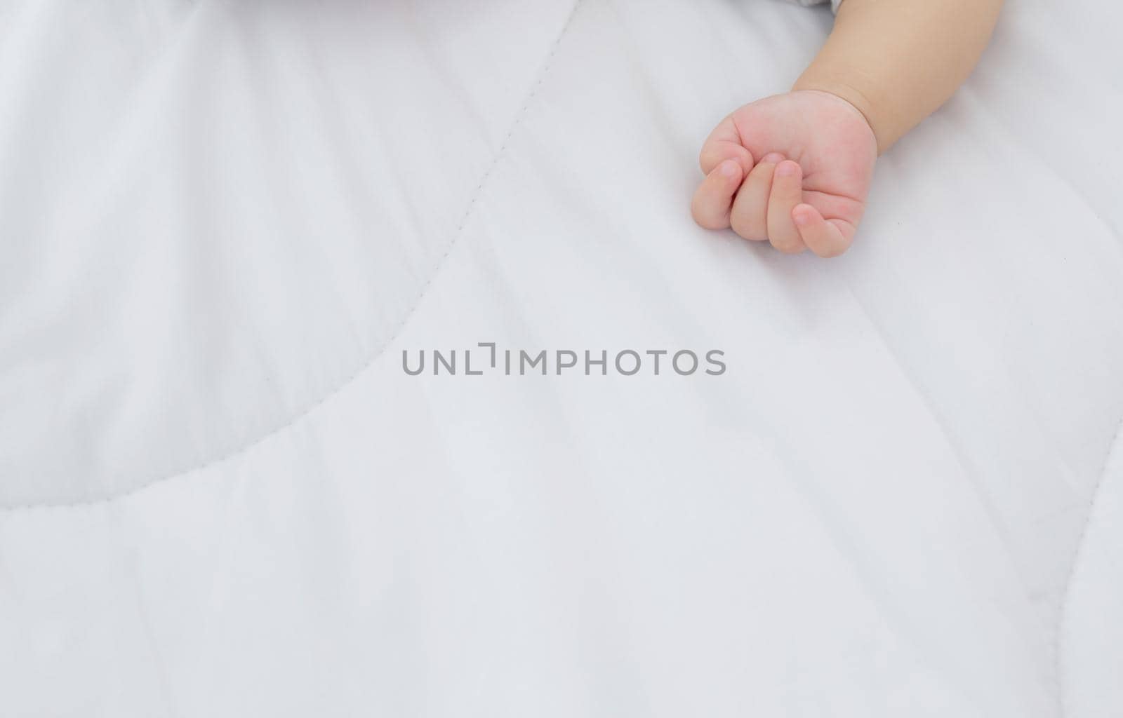 Portrait of asian little baby girl sleeping on bed in the bedroom at home, newborn napping with cozy and relax, infant innocence in bedtime, happy toddler cute, growth of child and emotion, indoors.