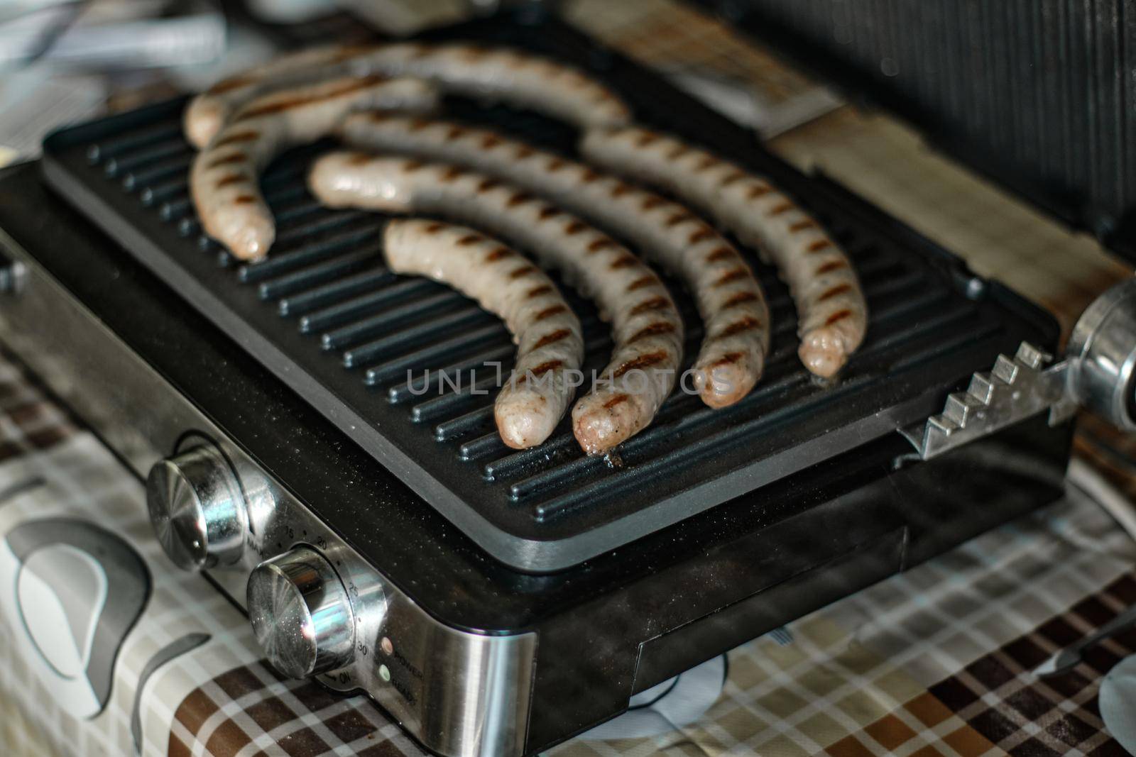 Grilled sausages are cooked by snep_photo