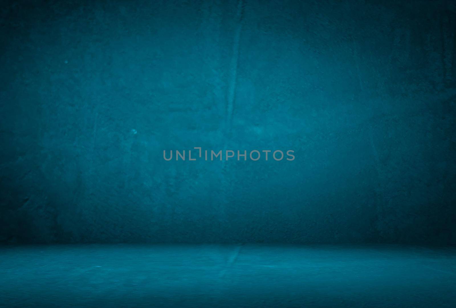 Vintage grunge blue concrete texture studio wall background with vignette