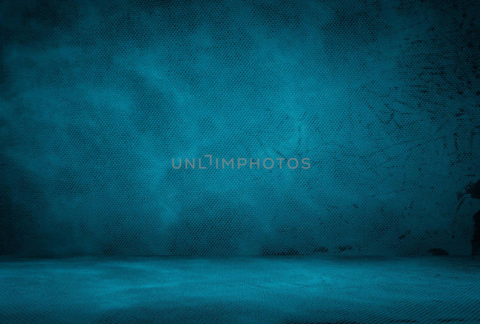 Vintage grunge blue concrete texture studio wall background with vignette