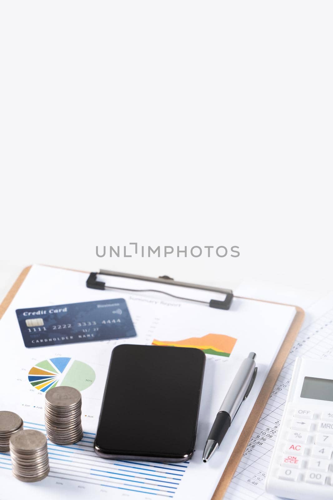 Design concept of annual summary analysis review report with calculator, paying with electronic device and credit card.
